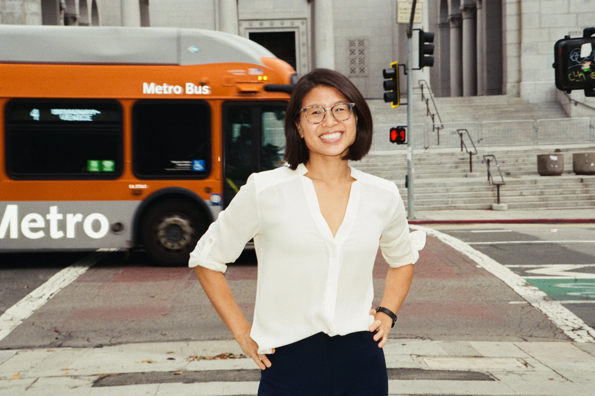 Rae in front of a Metro bus